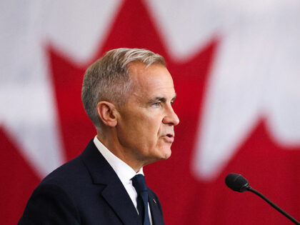 Canadian Prime Minister Mark Carney speaks as he attends a tour of the Fort York Armoury i