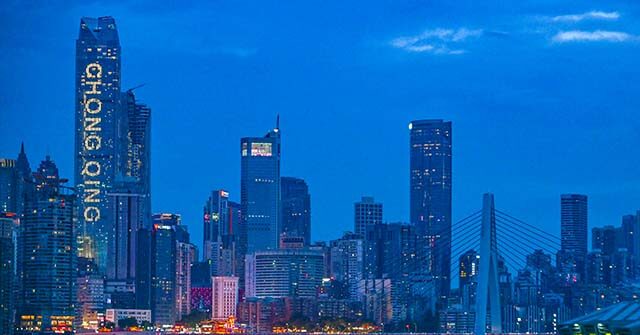 Chinese Activist Lights Up Skyscraper with Anti-Communist Slogan