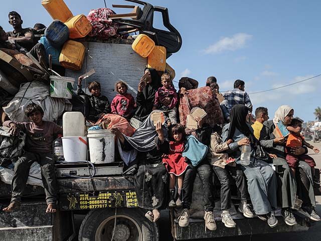GettyImages2235134275 Palestinians move toward central Gaza through Al-Rashid Street using vehicles or traveling