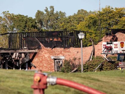 The burned church as emergency services respond to a shooting and fire at the Church of Je
