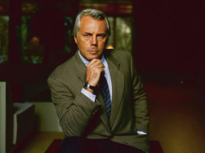 Fashion designer Giorgio Armani resting his chin on his hand, pictured at his home in Fort