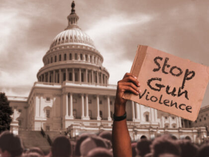 Stop Gun Violence - Protester holding sign in front of Capital Building Bill Oxford/iStoc