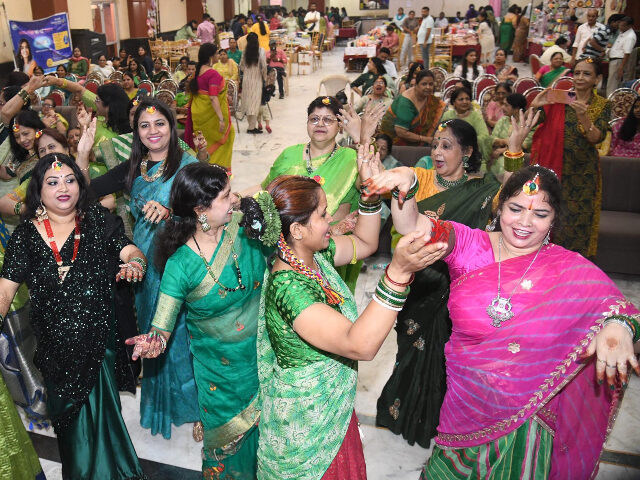 Indian women dancing Women of Bihar Pradesh Agarwal Mahila Sammelan performing their dance during Sawan Mahotsa