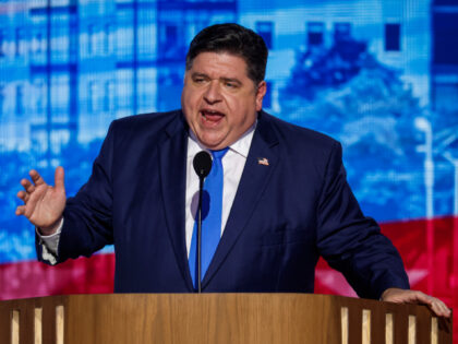Illinois Gov. J.B. Pritzker speaks on stage during the second day of the Democratic Nation