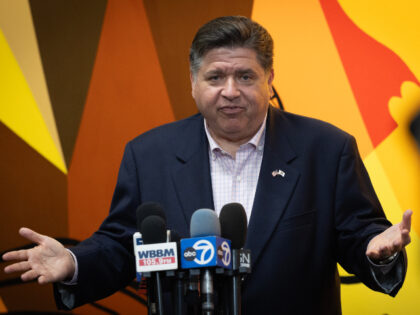 Illinois Gov. JB Pritzker speaks to the press following a visit to Metropolitan Peace Acad