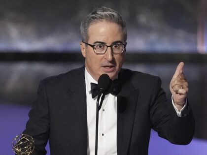 John Oliver accepts the award for outstanding scripted variety series for "Last Week