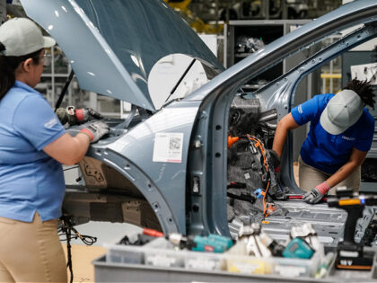 Workers assemble vehicles on the production floor at the Hyundai Metaplant electric vehicl