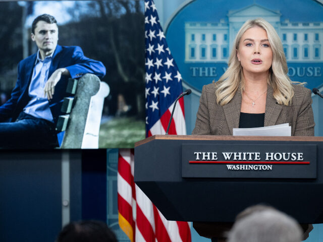 Karoline Leavitt and Charlie Kirk White House Press Secretary Karoline Leavitt speaks, alongside a photograph of Charlie Kir