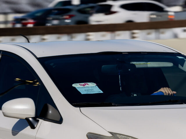 Lyft car Lyft signage on a vehicle at San Francisco International Airport (SFO) in San Francisco, C