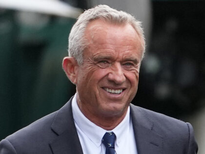 Health and Human Services Secretary Robert F. Kennedy Jr. and his wife Cheryl Hines walk t