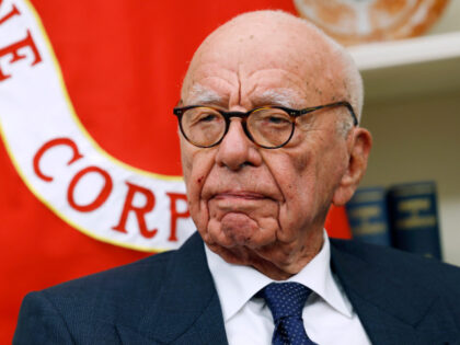 Former Executive Chairman of Fox Corp Rupert Murdoch listens as U.S. President Donald Trum