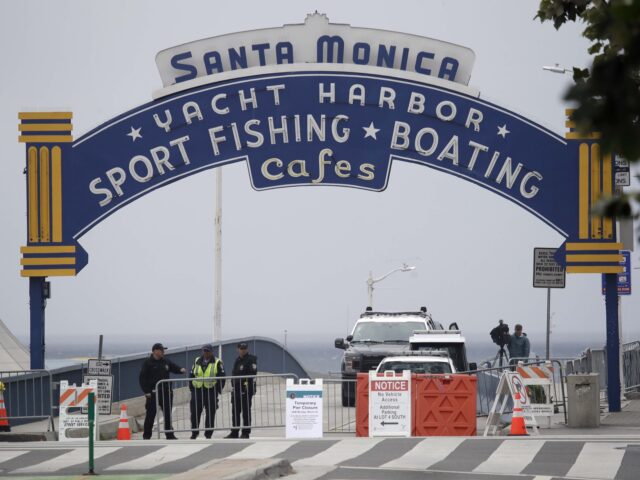 Santa Monica pier (Associated Press) Police officers oversee a temporary closure of the Santa Monica Pier as part of measures t