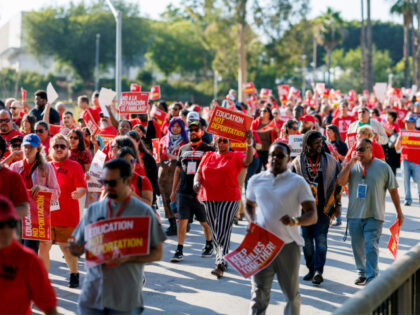 Hundreds of educators from UTLA march on the 4th Street overpass at the 110 freeway to &qu