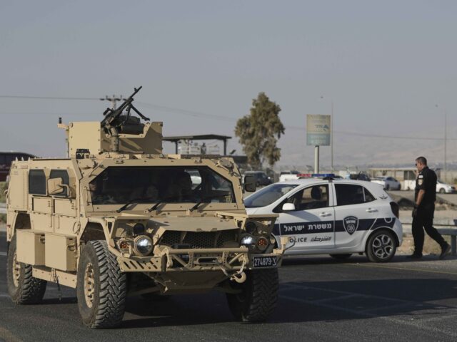 Terror attack aid truck (Mahmoud Illean / Associated Press) Israeli police and soldiers stand guard near the site of a shooting attack where Israeli o