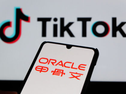 In this photo illustration, an ORACLE logo is displayed on a smartphone with a TikTok logo