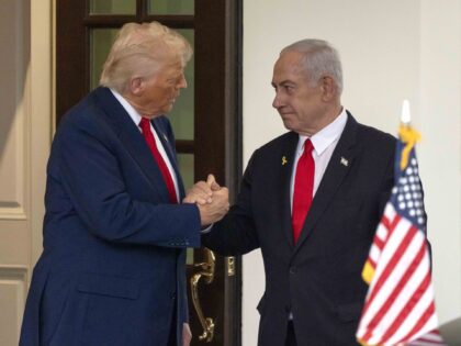 President Donald Trump, left, shakes hands with Israel's Prime Minister Benjamin Neta