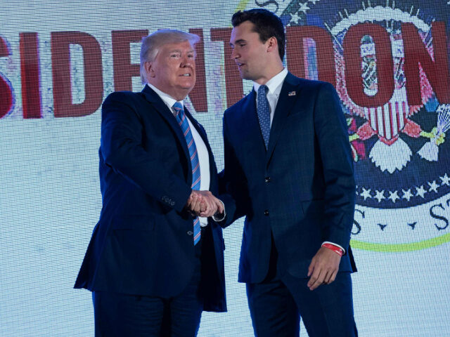 US President Donald Trump shakes hands with Charlie Kirk, head of Turning Point USA, befor