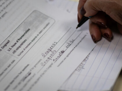 An immigrant studies to take a U.S. citizenship exam on March 29, 2025 at an undisclosed l