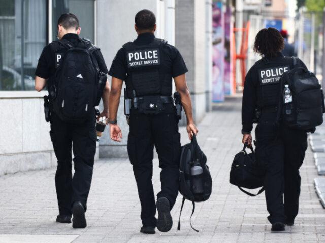 Police Secret Service officers are seen near the Walter E. Washington Convention Center ah