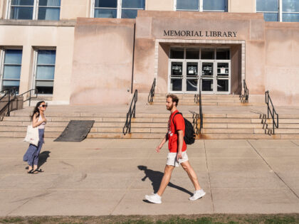 Eli Tsarovsky, 24, graduate student in the Public Health and Public Affairs program, walks