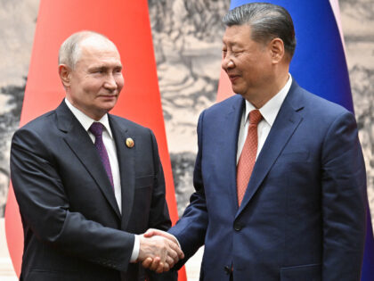 In this pool photograph distributed by the Russian state agency Sputnik, Russia's Pre