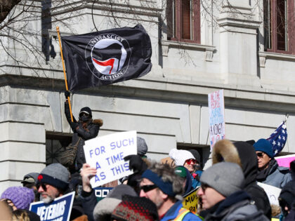HARRISBURG, PENNSYLVANIA, UNITED STATES - 2025/02/17: A protester waves an Antifascist Act