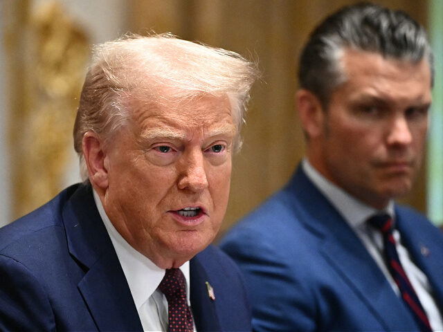 US President Donald Trump, alongside Secretary of Defense Pete Hegseth (R), speaks during