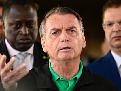 Former Brazilian President Jair Bolsonaro speaks to the press at the Federal Senate in Bra