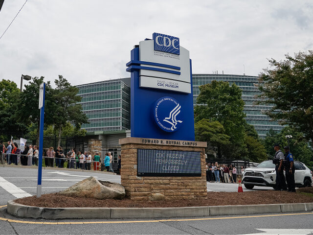 ATLANTA, GEORGIA - AUGUST 28: Employees of the Centers for Disease Control (CDC) line up t