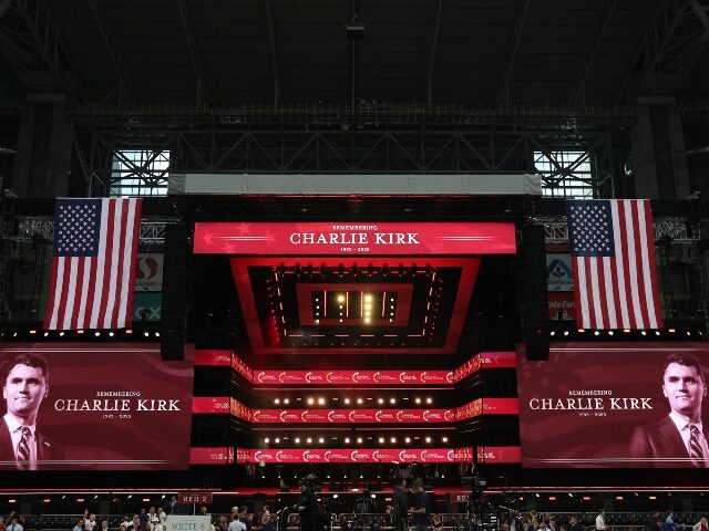 charlie-kirk-memorial-screens-flags-getty The stage is seen ahead of the public memorial service of right-wing activist Charlie Kirk