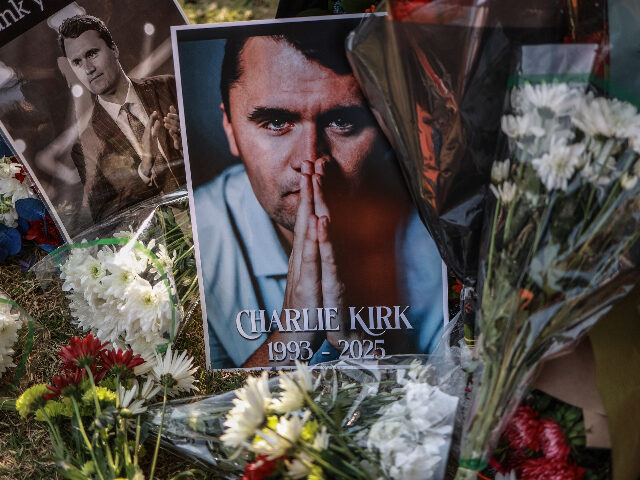 charliekirk A general view of a wreath laid by mourners outside the US Embassy in Pretoria on Septembe