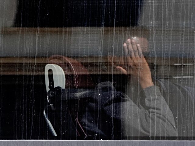 deportation A group of people thought to be migrants are driven away from the Border Force compound in