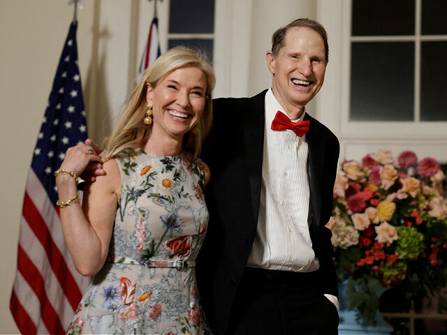 Senator Ron Wyden (D-OR) and his wife Nancy Wyden arrive for a State Dinner in honor of Au