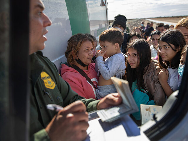 YUMA, ARIZONA - DECEMBER 09: A U.S. Border Patrol agent checks passports before taking rec