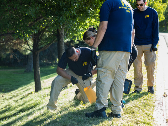 forensics crime scene Charlie Kirk assassination Law enforcement officials, including members of an FBI forensics team, investigate near th