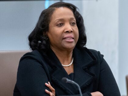 FILE - Federal Reserve Board of Governors member Lisa Cook listens during an open meeting