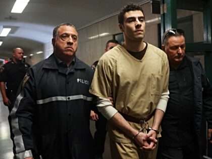 NEW YORK, NEW YORK - SEPTEMBER 16: Luigi Mangione is escorted by police as he arrives for