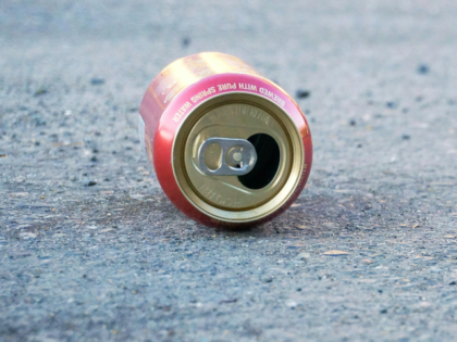 Empty Can on Concrete Floor