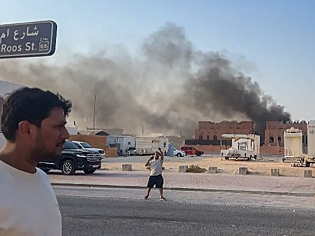 This frame grab taken from an AFPTV footage shows smoke billowing after explosions in Qata
