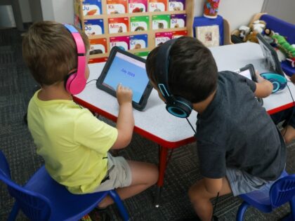 students using tablets in school