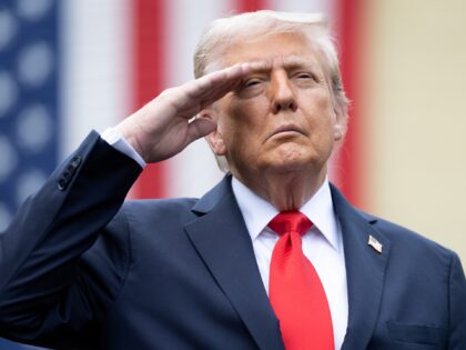 RLINGTON, VIRGINIA - SEPTEMBER 11: U.S. President Donald Trump salutes during the playing