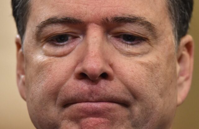 FBI Director James Comey looks on during the House Permanent Select Committee on Intellige