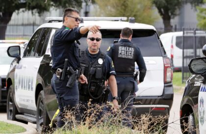 Police investigate the scene where a shooter opened fire on a US Immigration and Customs E