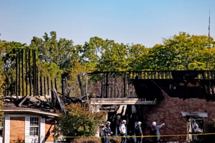 Police survey the remains of the Church of Jesus Christ of Latter-day Saints in Grand Blan