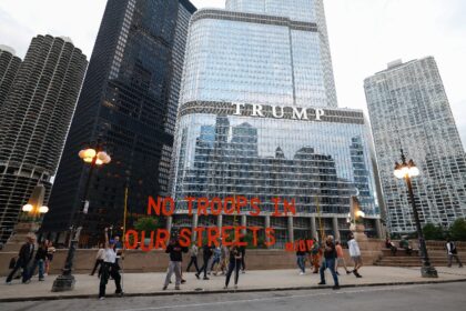 Protesters march past Trump International Hotel & Tower in Chicago during a demonstrat