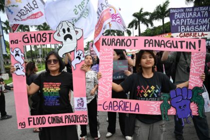Protesters rallied in Manila against misused floof relief funds Sunday as a new super typh