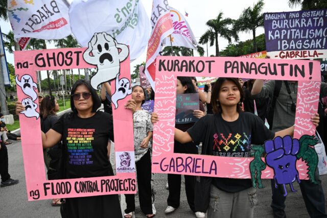 Protesters rallied in Manila against misused floof relief funds Sunday as a new super typh