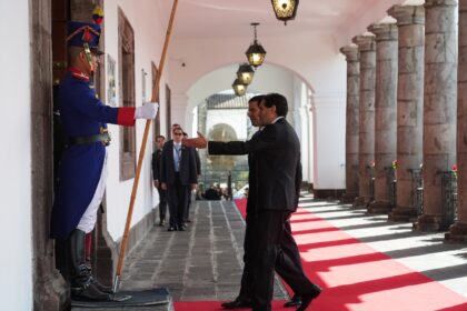 A protocol officer accompanies US Secretary of State Marco Rubio to a meeting with Ecuador