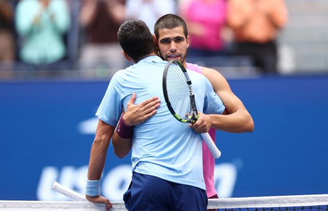 Spain's Carlos Alcaraz embraces Novak Djokovic at the net following his US Open semi-