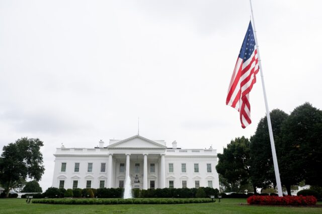 The US flag flies at half-staff outside the White House to honor conservative commentator